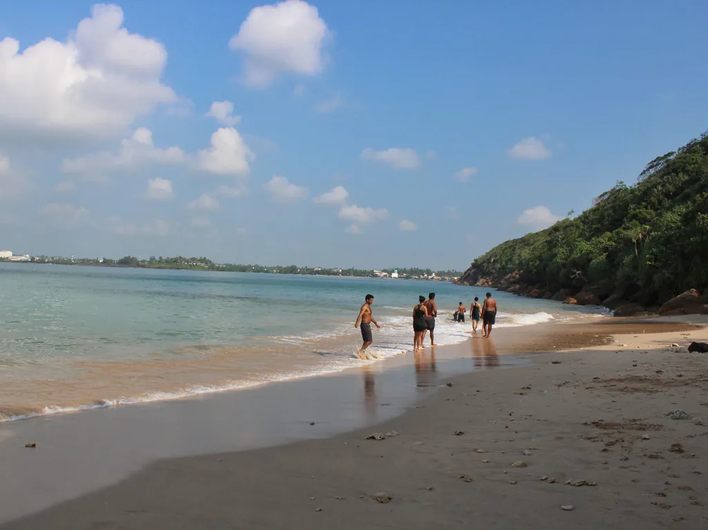The sheltered cove of Jungle Beach near Unawatuna, backed by forest