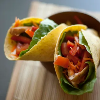 A chicken wrap filled with vegetables