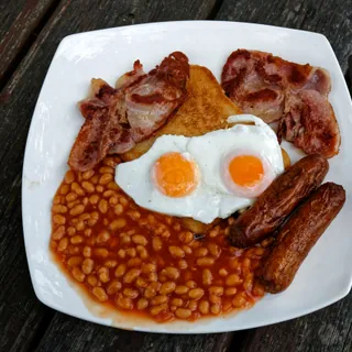 A full English breakfast of eggs, bacon, sausages and baked beans