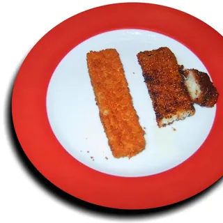 Crispy golden fish fingers on a plate