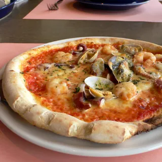 A seafood pizza with prawns and clams