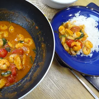 A Thai red curry with prawns, served with rice